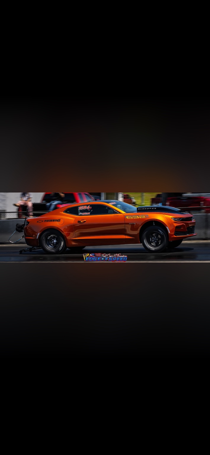 G&G Motorsports orange COPO Camaro launching at the drag strip